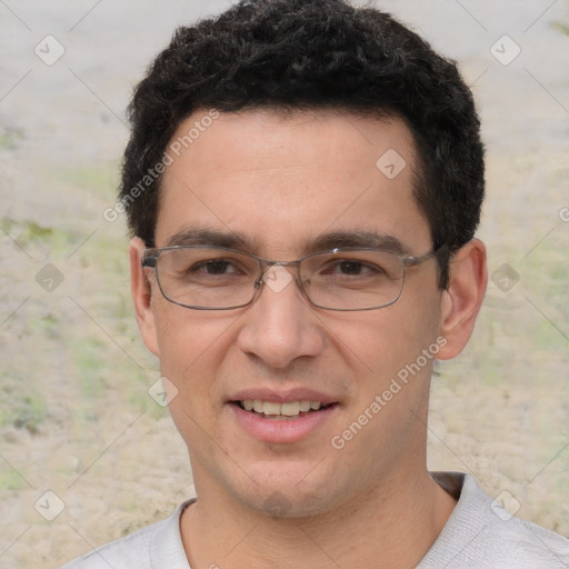 Joyful white young-adult male with short  black hair and brown eyes