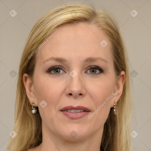 Joyful white adult female with long  brown hair and grey eyes