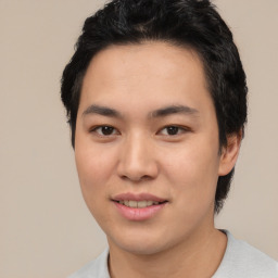 Joyful asian young-adult male with short  black hair and brown eyes