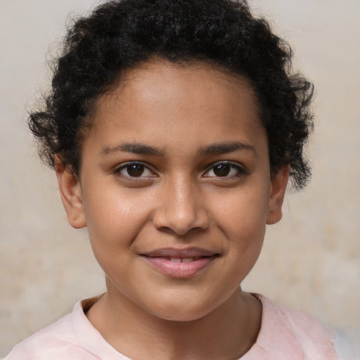 Joyful latino child female with short  brown hair and brown eyes
