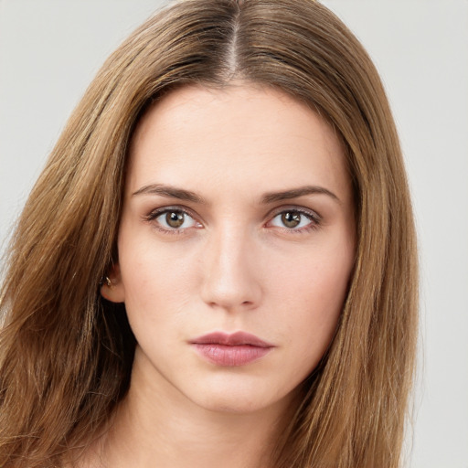 Neutral white young-adult female with long  brown hair and brown eyes