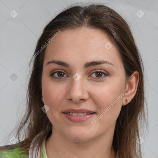 Joyful white young-adult female with long  brown hair and grey eyes