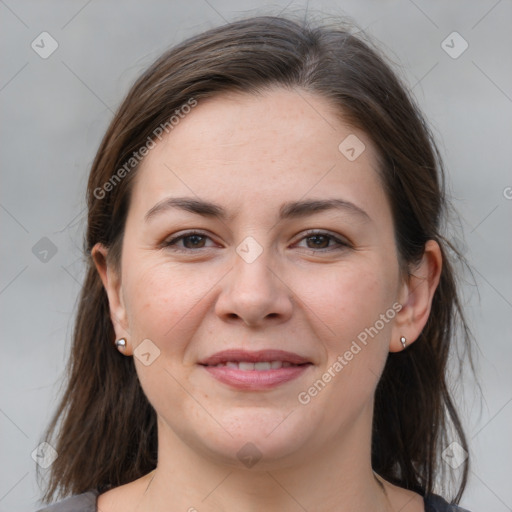 Joyful white young-adult female with medium  brown hair and brown eyes