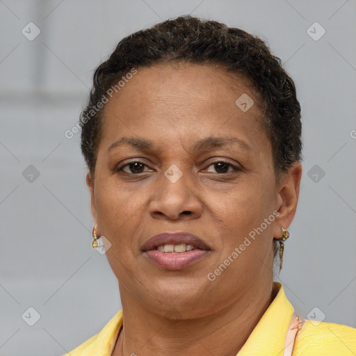 Joyful black adult female with short  brown hair and brown eyes