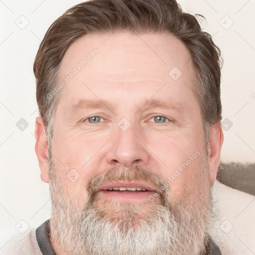 Joyful white adult male with short  brown hair and grey eyes