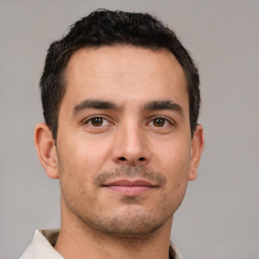 Neutral white young-adult male with short  brown hair and brown eyes