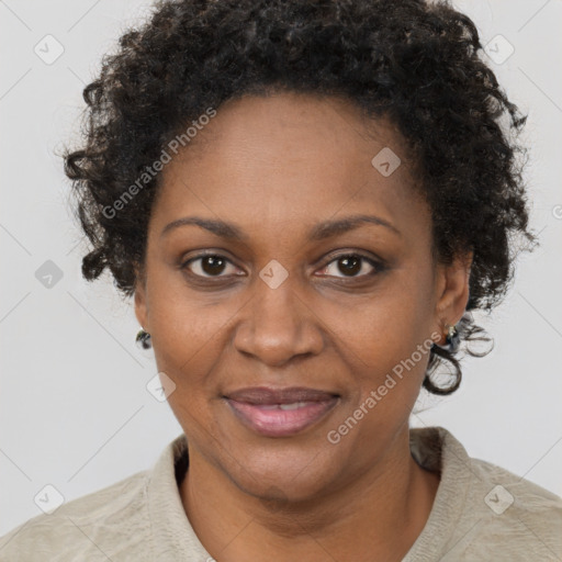 Joyful black adult female with short  brown hair and brown eyes