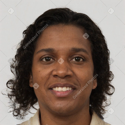 Joyful black young-adult female with medium  brown hair and brown eyes