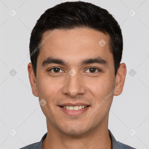 Joyful white young-adult male with short  black hair and brown eyes