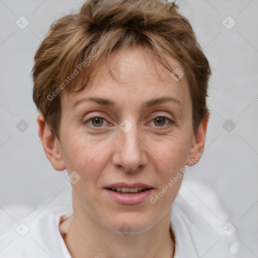 Joyful white adult female with short  brown hair and grey eyes