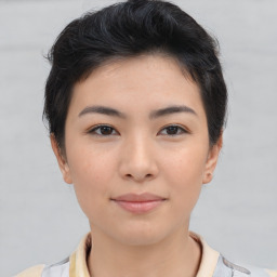 Joyful asian young-adult female with short  brown hair and brown eyes