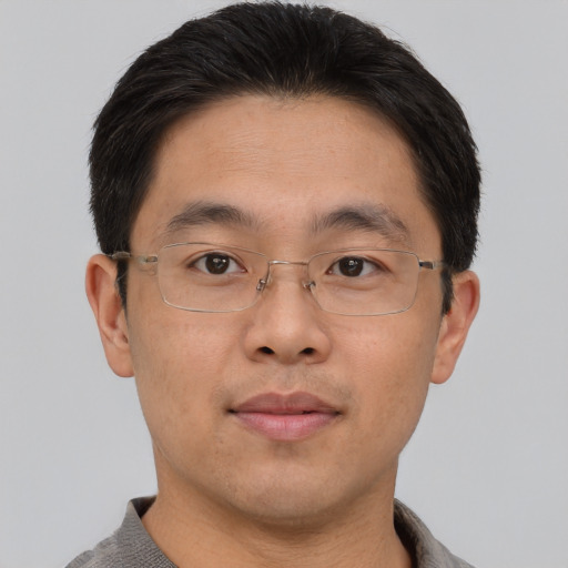 Neutral asian adult male with short  brown hair and brown eyes