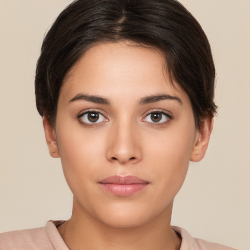 Neutral white young-adult female with short  brown hair and brown eyes