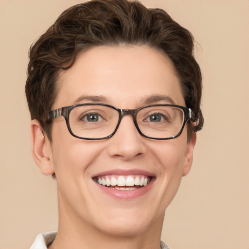 Joyful white adult female with short  brown hair and green eyes