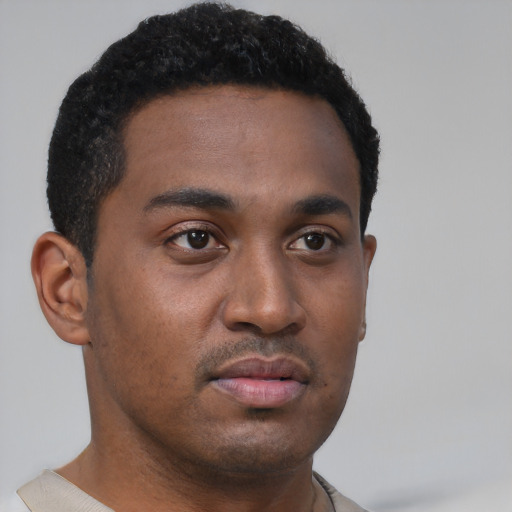 Neutral latino young-adult male with short  brown hair and brown eyes