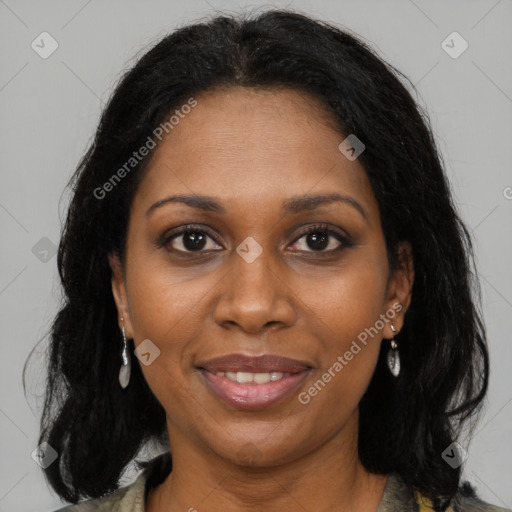 Joyful black adult female with medium  brown hair and brown eyes