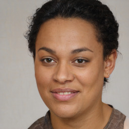 Joyful latino young-adult female with short  brown hair and brown eyes