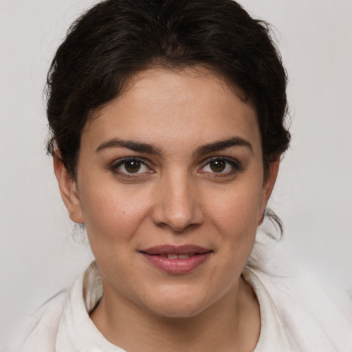 Joyful white young-adult female with medium  brown hair and brown eyes