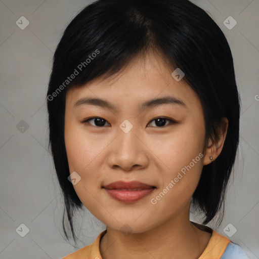 Joyful asian young-adult female with medium  black hair and brown eyes
