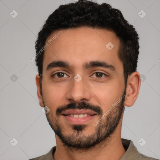 Joyful white young-adult male with short  black hair and brown eyes