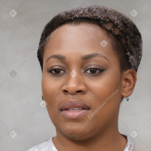 Joyful black young-adult female with short  brown hair and brown eyes