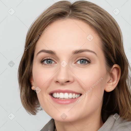 Joyful white young-adult female with medium  brown hair and blue eyes