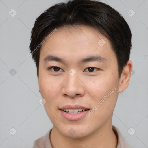 Joyful asian young-adult male with short  brown hair and brown eyes