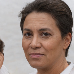 Joyful white adult female with short  brown hair and brown eyes