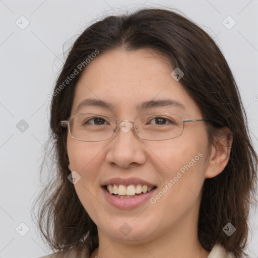 Joyful white adult female with medium  brown hair and brown eyes