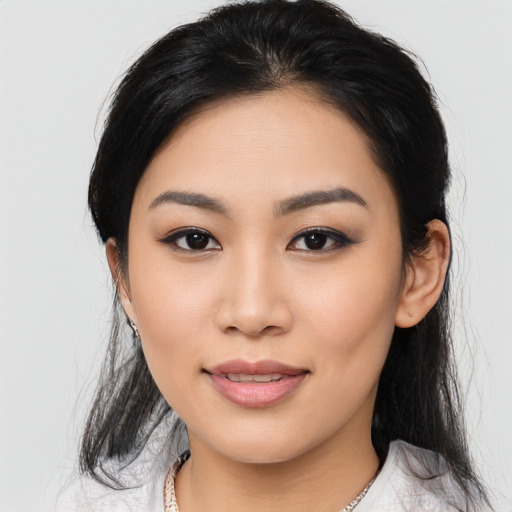 Joyful asian young-adult female with medium  black hair and brown eyes