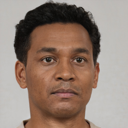 Neutral black adult male with short  brown hair and brown eyes