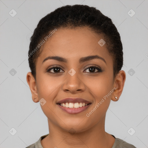 Joyful latino young-adult female with short  brown hair and brown eyes