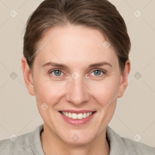 Joyful white adult female with short  brown hair and grey eyes