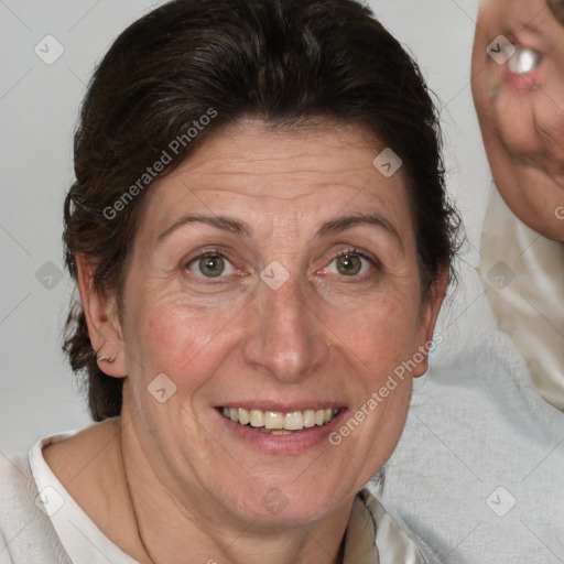 Joyful white adult female with medium  brown hair and blue eyes