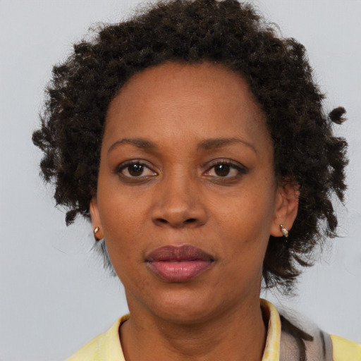 Neutral black adult female with short  brown hair and brown eyes