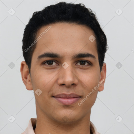 Joyful latino young-adult male with short  brown hair and brown eyes