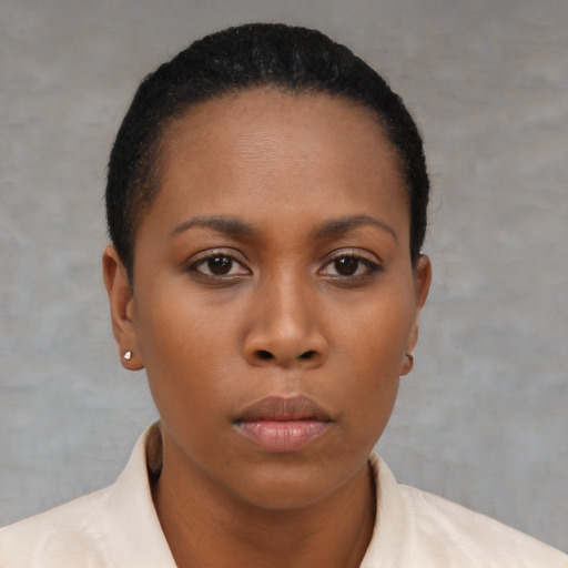 Neutral black young-adult female with short  brown hair and brown eyes