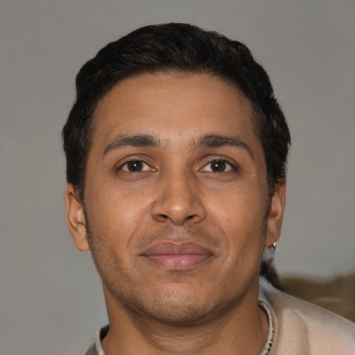 Neutral latino adult male with short  brown hair and brown eyes