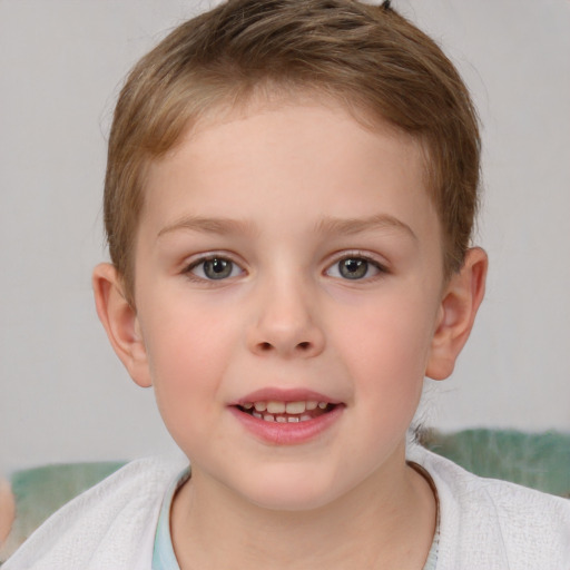 Joyful white child male with short  brown hair and brown eyes