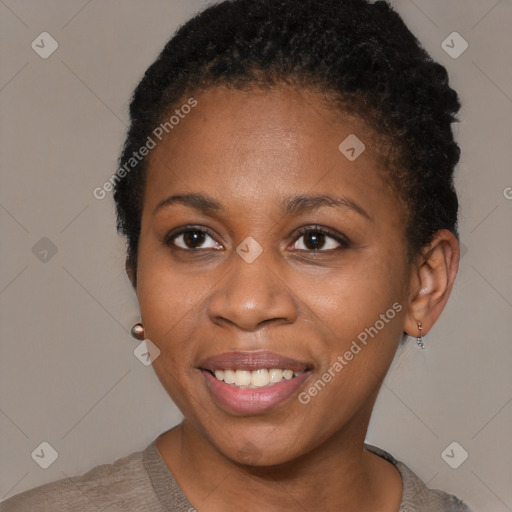 Joyful black young-adult female with short  brown hair and brown eyes