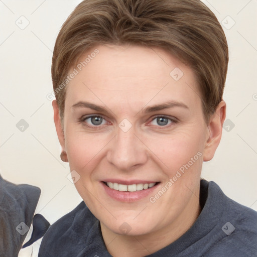 Joyful white young-adult female with short  brown hair and grey eyes