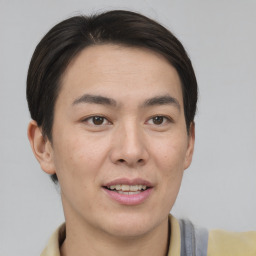 Joyful asian young-adult male with short  brown hair and brown eyes