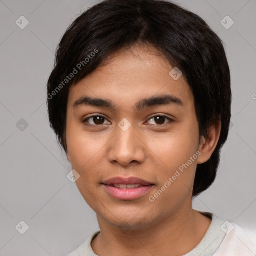 Joyful asian young-adult female with short  black hair and brown eyes