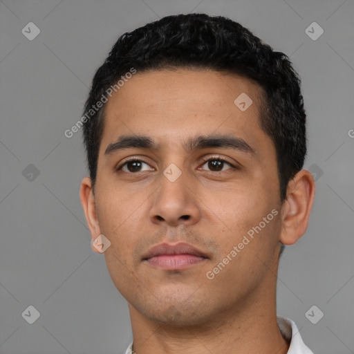 Neutral latino young-adult male with short  black hair and brown eyes