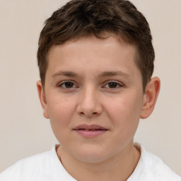 Joyful white child male with short  brown hair and brown eyes