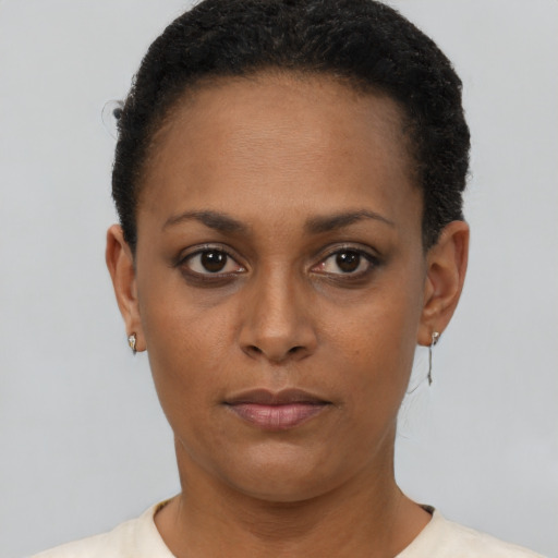 Neutral black young-adult female with short  brown hair and brown eyes