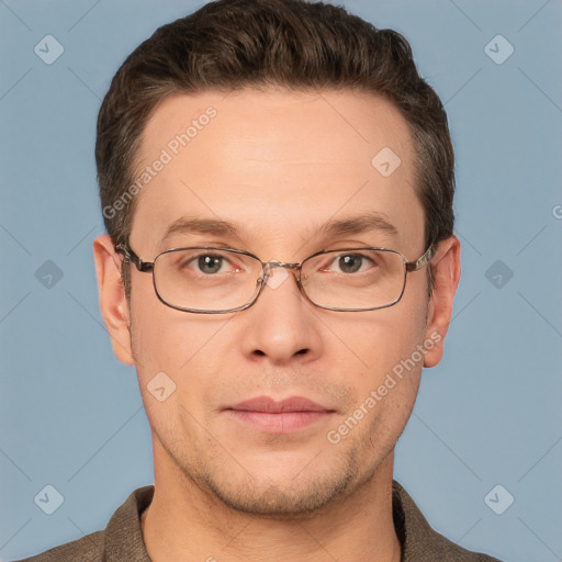 Joyful white adult male with short  brown hair and grey eyes