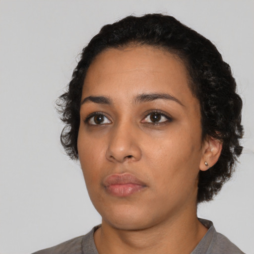 Neutral latino young-adult female with short  black hair and brown eyes