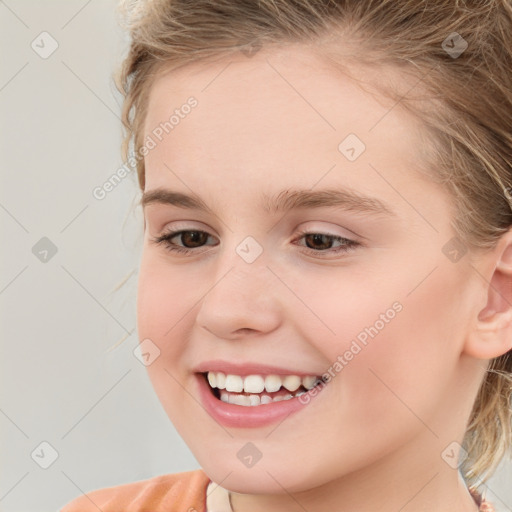 Joyful white child female with medium  brown hair and brown eyes