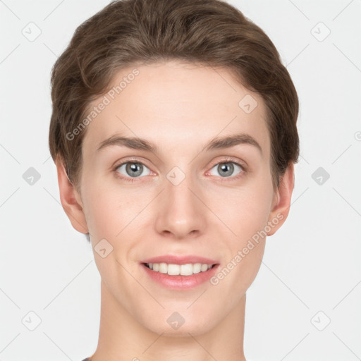 Joyful white young-adult female with short  brown hair and grey eyes